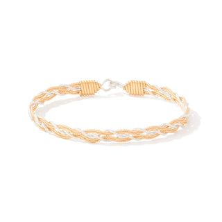 Gold and silver braided bracelet on a white background