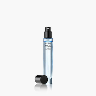 Perfume bottle with black cap on a white background