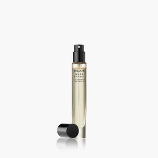 Perfume bottle with black cap on a white background