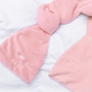 Pink plush weighted eye mask white background