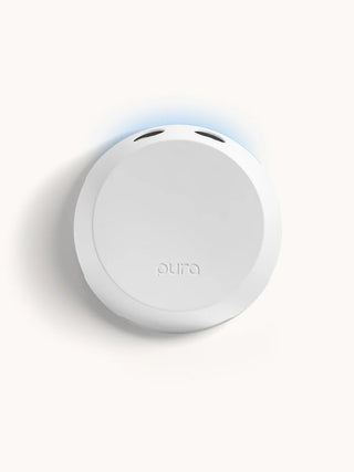Round white device with 'pura' branding on a light gray background