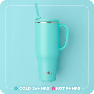 Turquoise mug with handle and straw on a light blue background, featuring the Swig brand.