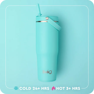 Turquoise swig tumbler with straw on a light blue background