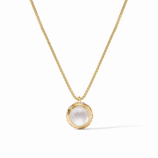 Gold necklace with a round pendant on a white background