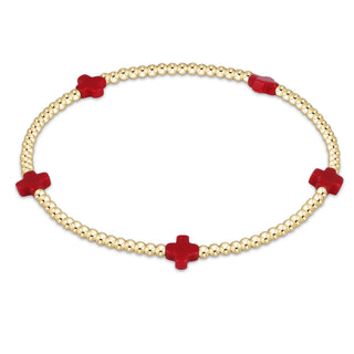 Bracelet with red flower-shaped beads on a white background