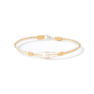 Gold and silver bracelet with a pearl on a white background