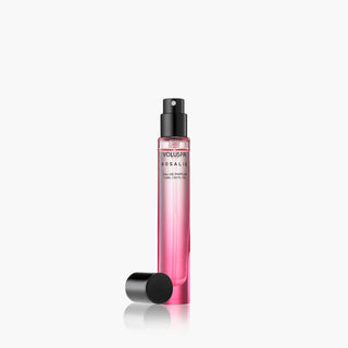 Pink spray bottle with black cap on a white background