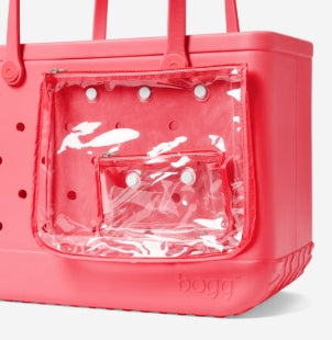 Pink pet carrier with clear front panel on a white background