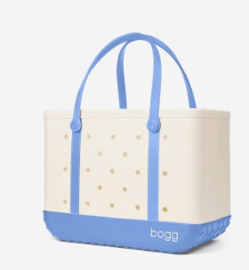 Beige tote bag with blue accents and 'bogg' branding on a white background