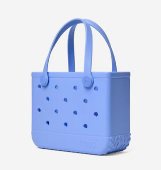 Blue silicone tote bag with handles on a light gray background