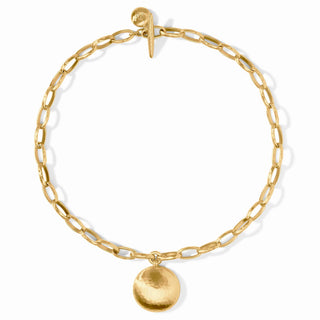 Gold chain bracelet with a round pendant on a white background