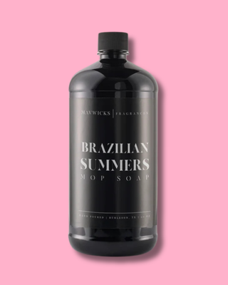 Black bottle of 'Brazilian Summers' mop soap on a pink background