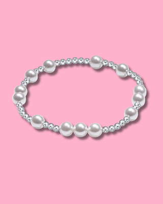 Pearl bracelet on a pink background