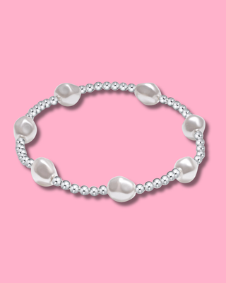 Pearl bracelet on a pink background