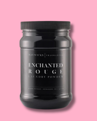 Black jar of 'Enchanted Rouge' laundry powder on a pink background
