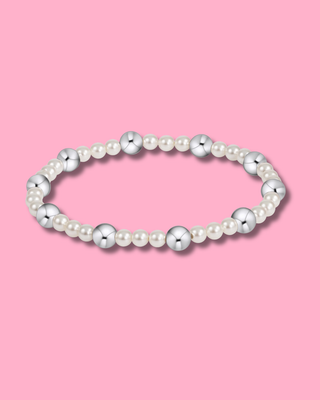 Pearl bracelet on a pink background
