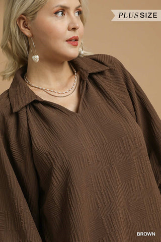 Woman wearing a brown blouse with 'Plus Size' and 'Brown' text on a beige background