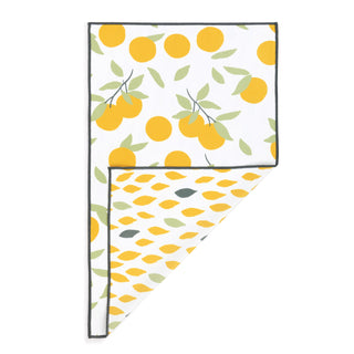 Two towels with lemon pattern on a white background