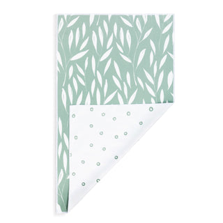 Two sheets of paper with leaf patterns on a white background