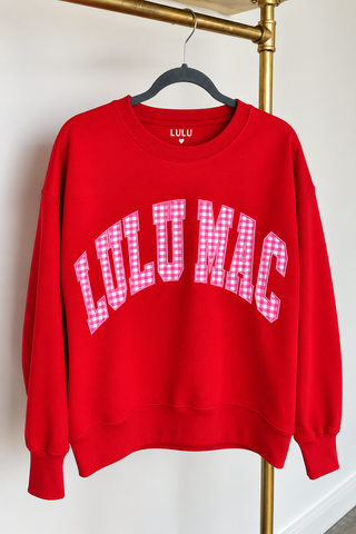 red crewneck sweatshirt with 'LULU MAC' in white arched letters