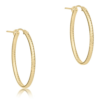 Gold hoop earrings on a white background