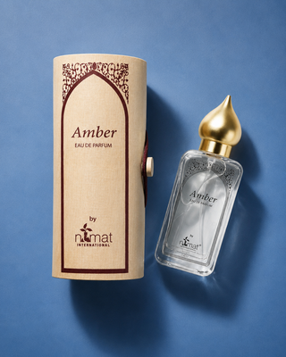 Amber Eau de Parfum bottle and packaging on a blue background