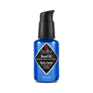 Blue bottle of Jack Black beard oil on a white background