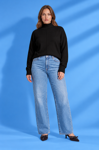 Black mock neck sweater with long sleeves, ribbed cuffs and hem, relaxed fit, and center seam detail.