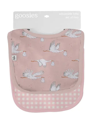 Pink bib with stork design and gingham pattern, branded 'goosies'.
