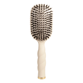 Round hairbrush with black bristles on a white background