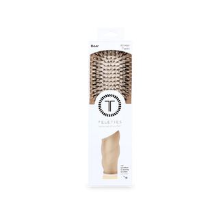 Teleties hairbrush packaging with a white background