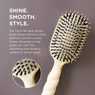 Teleties boar bristle brush with text on a gray background