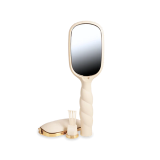 Beige handheld mirror with a white background