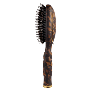 Leopard print hairbrush on a white background