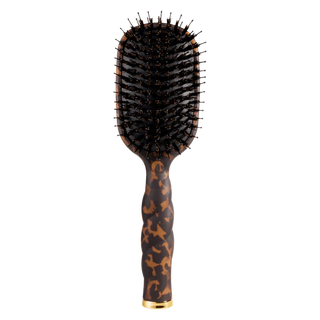 Hairbrush with tortoiseshell handle on a white background