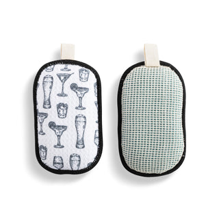 Two cleaning pads with different patterns on a white background