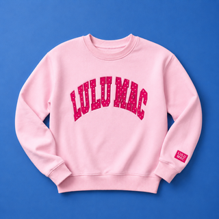 Pink sweatshirt with 'LULU MAC' text on a blue background