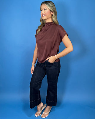 Mock Neck Cap Sleeve Top featuring a draped neckline, cap sleeves, and elegant gathered side detail.