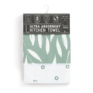 Green and white kitchen towel with leaf pattern on packaging