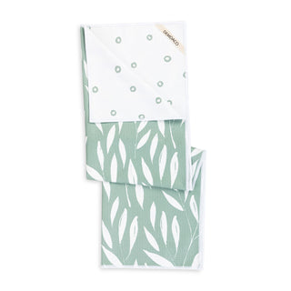 Two folded fabric swatches with different patterns on a white background
