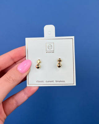 eNewton Small Gold Cross Stud Earrings in classic gold featuring petite gold cross studs with polished gold ball accents and secure post backs displayed on an eNewton jewelry card.