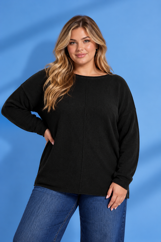 Black long sleeve top with a relaxed fit, round neckline, dropped shoulders, and center seam detail.