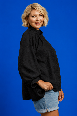 Blue Button Up Tiered Denim Top in soft 100% Tencel with a button front, chest pocket, tiered peplum hem, and relaxed fit.