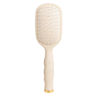 Beige paddle hairbrush with gold accents on a white background