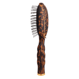 Hairbrush with tortoiseshell pattern on a white background