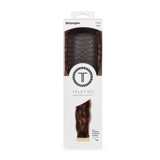 Teleties detangler with tortoiseshell design in packaging on a white background