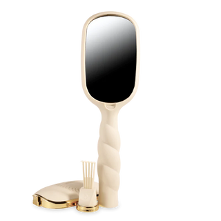 Handheld mirror with a gold base on a white background