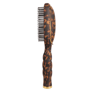 Hairbrush with tortoiseshell pattern on a white background