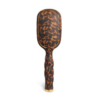 Leopard print hairbrush on a white background