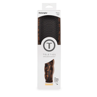 Teleties detangler brush packaging on a white background
